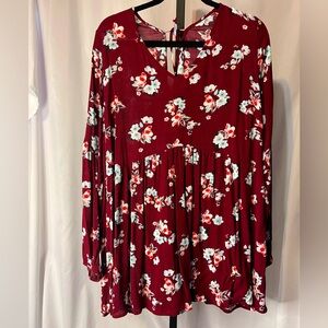 Long sleeve swing tunic in paprika with flowers. Tie closure in back. NWT